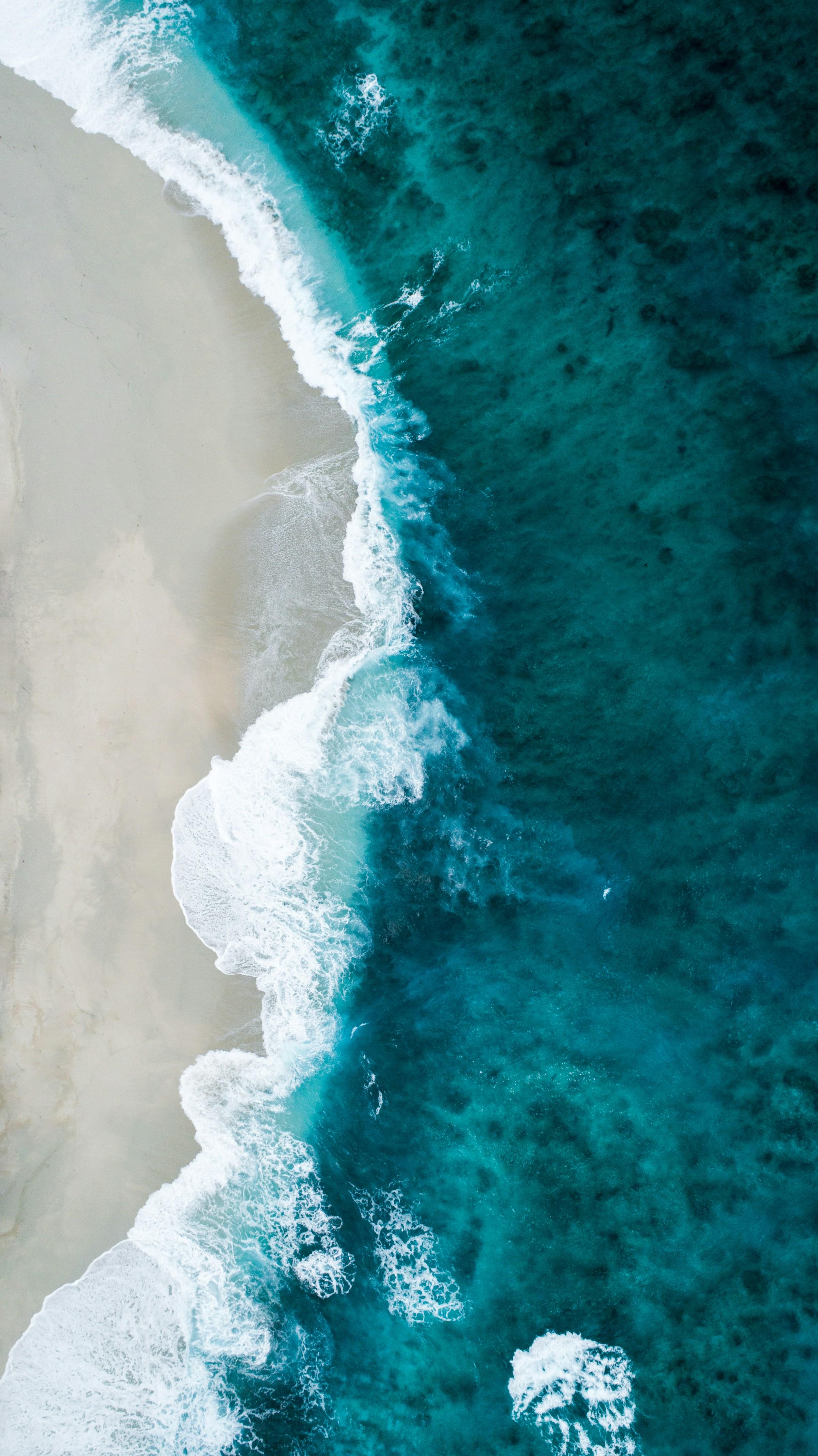 Aerial view of waves breaking on a beach